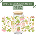 Glass cup with wooden lid and UV DTF decorative elements on a white background